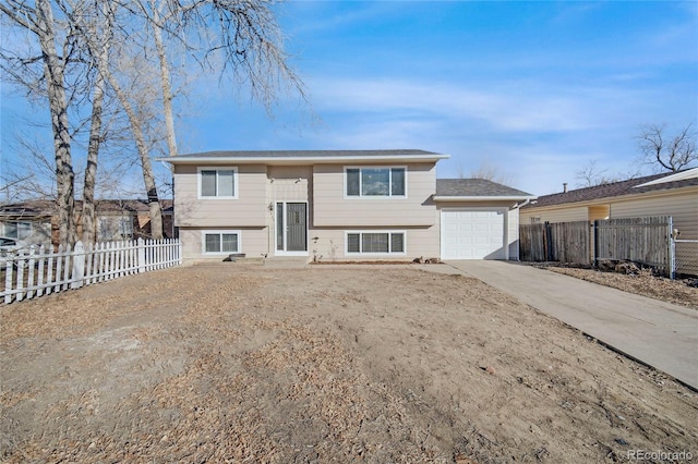 raised ranch featuring a garage