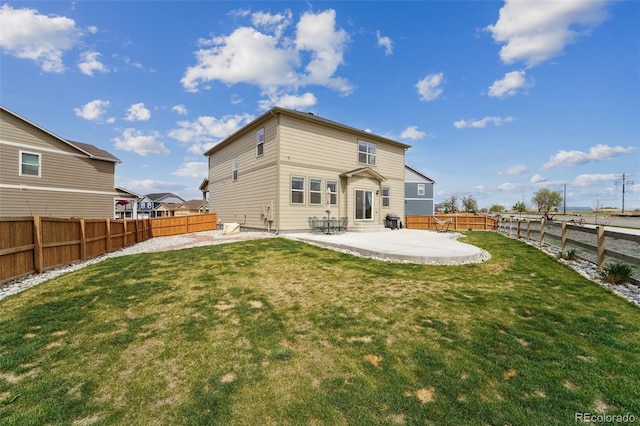 2201 Monte Vista St, Fort Lupton, CO 80621 - rear view of house with a fenced backyard, a lawn, and a patio area