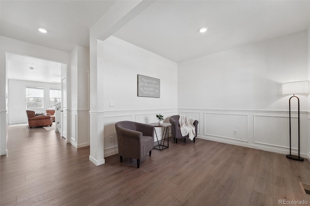 2201 Monte Vista St, Fort Lupton, CO 80621 - living area with recessed lighting, wood finished floors, and a wainscoted wall