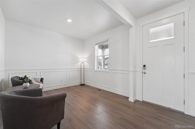 2201 Monte Vista St, Fort Lupton, CO 80621 - entryway featuring wainscoting, wood finished floors, and visible vents