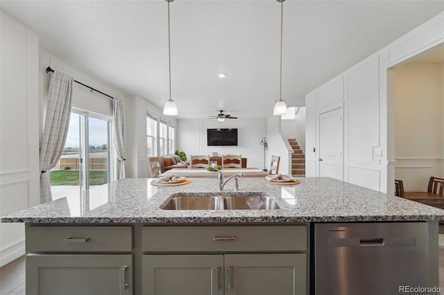 2201 Monte Vista St, Fort Lupton, CO 80621 - kitchen with ceiling fan, a sink, dishwasher, open floor plan, and gray cabinetry
