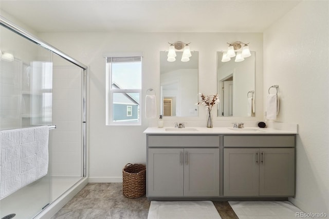 2201 Monte Vista St, Fort Lupton, CO 80621 - full bath featuring double vanity, a sink, baseboards, and a stall shower
