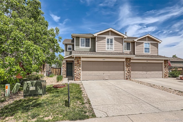 5957 Turnstone Pl, Castle Rock, CO 80104 - view of front of property featuring stone siding, concrete driveway, an attached garage, and roof with shingles