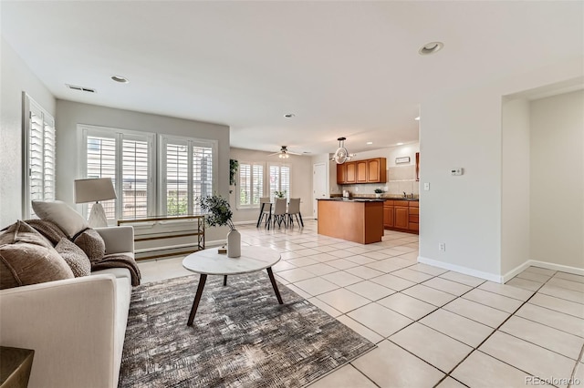 5957 Turnstone Pl, Castle Rock, CO 80104 - living area featuring light tile patterned flooring, baseboards, recessed lighting, and a ceiling fan