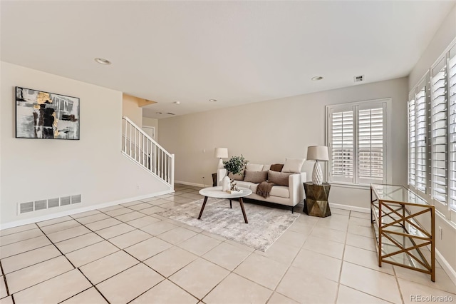 5957 Turnstone Pl, Castle Rock, CO 80104 - tiled living area with baseboards, healthy amount of natural light, stairs, and recessed lighting