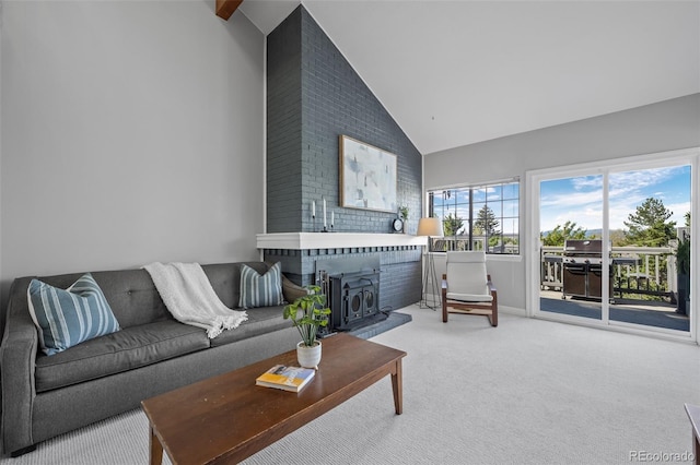 carpeted living room with high vaulted ceiling