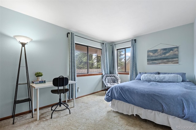 bedroom featuring carpet flooring and baseboards