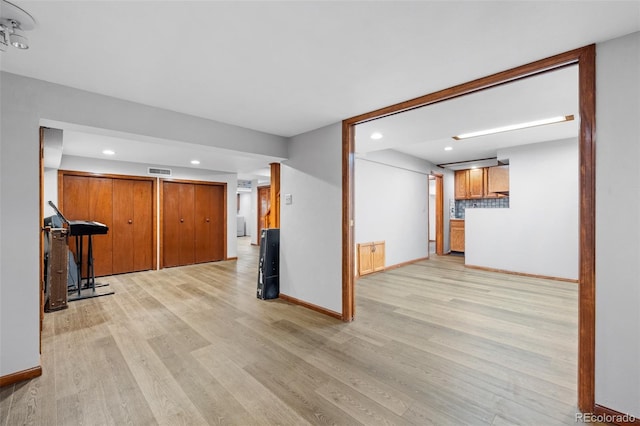interior space with light wood-style floors, baseboards, recessed lighting, and visible vents