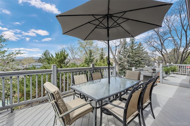 wooden deck with outdoor dining space
