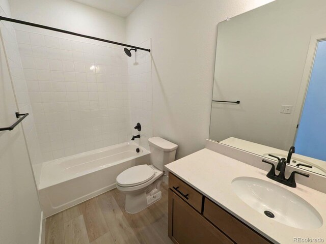 8326 Cokedale Cir, Littleton, CO 80125 - full bath with wood finished floors, toilet, vanity, and  shower combination