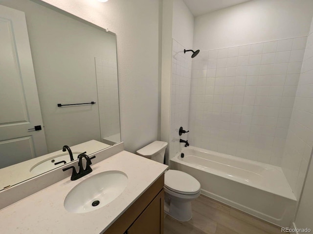 8326 Cokedale Cir, Littleton, CO 80125 - bathroom featuring wood finished floors, vanity, bathing tub / shower combination, and toilet