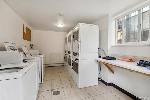 washroom with washer and dryer, stacked washing maching and dryer, and light tile patterned floors