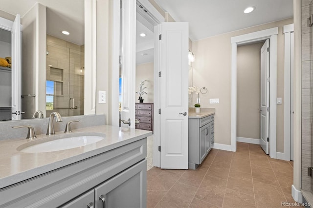 full bath featuring baseboards, a shower stall, recessed lighting, vanity, and tile patterned floors