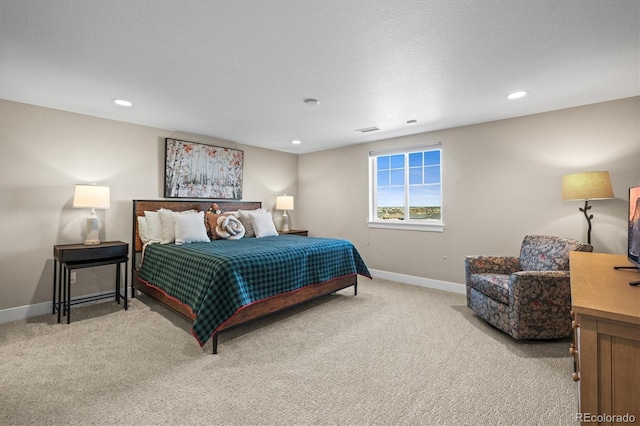 carpeted bedroom featuring visible vents, baseboards, and recessed lighting