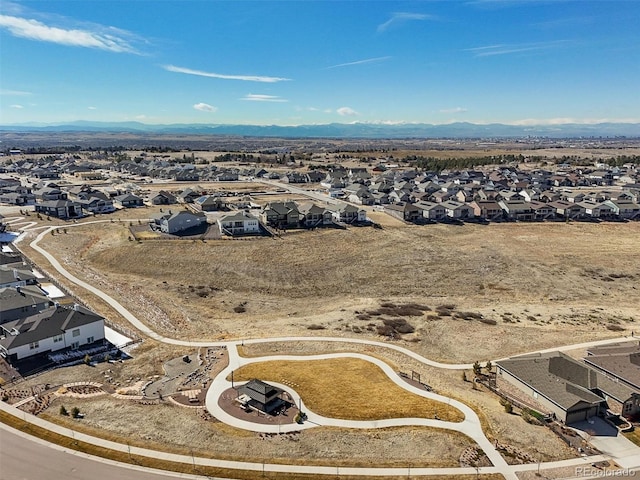 drone / aerial view featuring a mountain view and a residential view