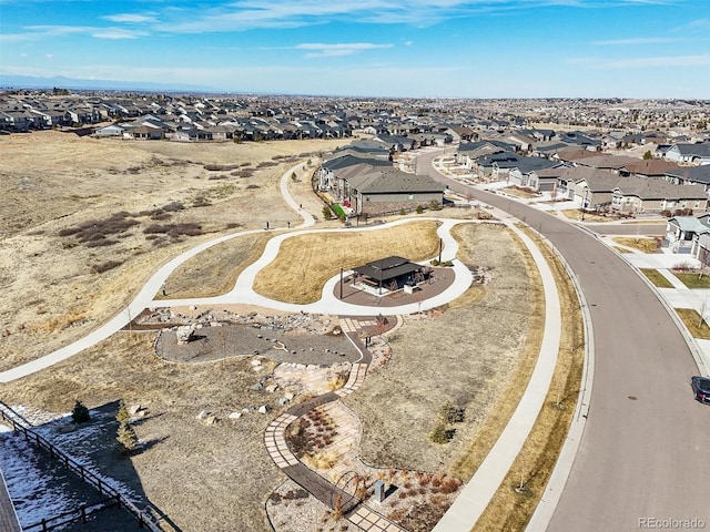 birds eye view of property with a residential view