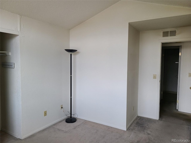 4760 S Wadsworth Unit 301, Littleton, CO 80123 - empty room featuring carpet flooring, baseboards, and vaulted ceiling