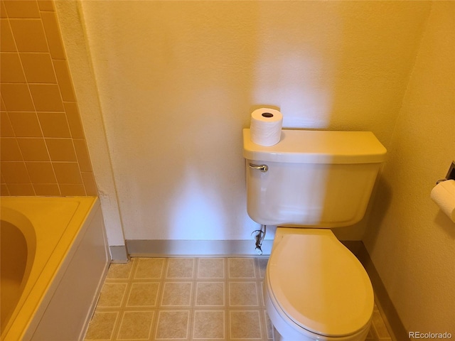 4760 S Wadsworth Unit 301, Littleton, CO 80123 - full bath with toilet, a tub, baseboards, and a shower