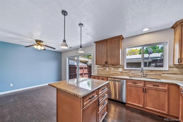 3806 S Yosemite St, Denver, CO 80237 - kitchen with stainless steel dishwasher, a sink, a textured ceiling, backsplash, and a ceiling fan