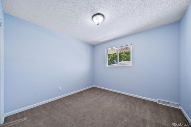 3806 S Yosemite St, Denver, CO 80237 - spare room featuring carpet flooring, baseboards, and a textured ceiling