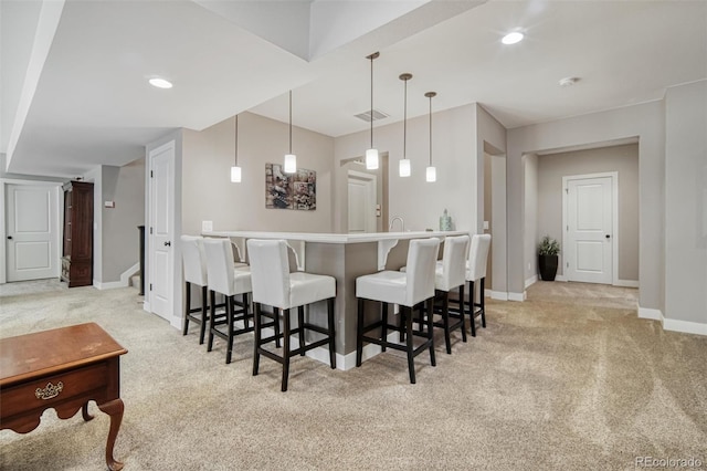 15804 Elizabeth Cir E, Thornton, CO 80602 - indoor bar featuring light colored carpet, baseboards, and pendant lighting