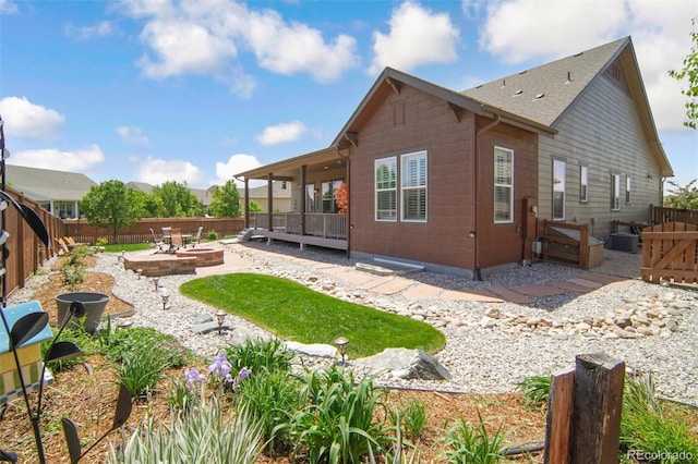 15804 Elizabeth Cir E, Thornton, CO 80602 - rear view of property featuring a patio area, a fenced backyard, and a wooden deck