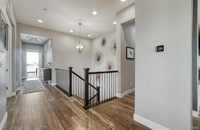 15804 Elizabeth Cir E, Thornton, CO 80602 - corridor featuring an upstairs landing, hardwood / wood-style flooring, recessed lighting, and baseboards