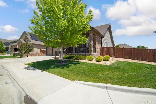 15804 Elizabeth Cir E, Thornton, CO 80602 - obstructed view of property featuring concrete driveway and stone siding
