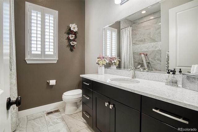 15804 Elizabeth Cir E, Thornton, CO 80602 - bathroom with vanity, toilet, baseboards, marble finish flooring, and a shower with curtain
