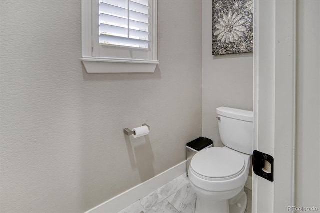15804 Elizabeth Cir E, Thornton, CO 80602 - bathroom featuring toilet and marble finish flooring