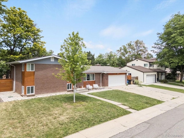 10833 W 61st Ave, Arvada, CO 80004 - tri-level home with brick siding, concrete driveway, an attached garage, and a front yard