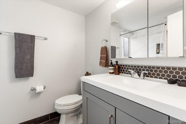 10833 W 61st Ave, Arvada, CO 80004 - bathroom featuring vanity, a shower, tile patterned flooring, and tasteful backsplash
