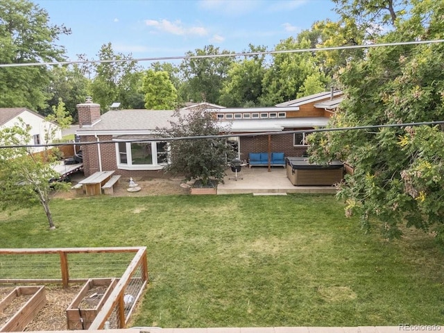 10833 W 61st Ave, Arvada, CO 80004 - rear view of house with brick siding, a patio, a chimney, and an outdoor living space