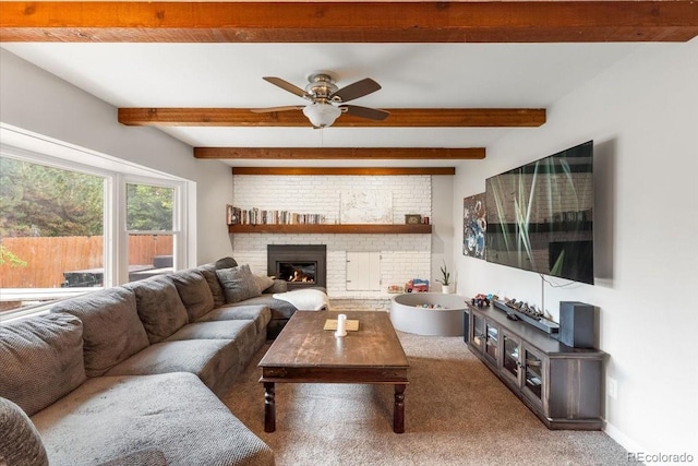 10833 W 61st Ave, Arvada, CO 80004 - living room with beamed ceiling, carpet floors, a ceiling fan, and a brick fireplace