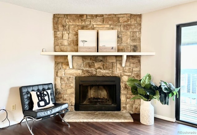 detailed view of wood finished floors and a fireplace