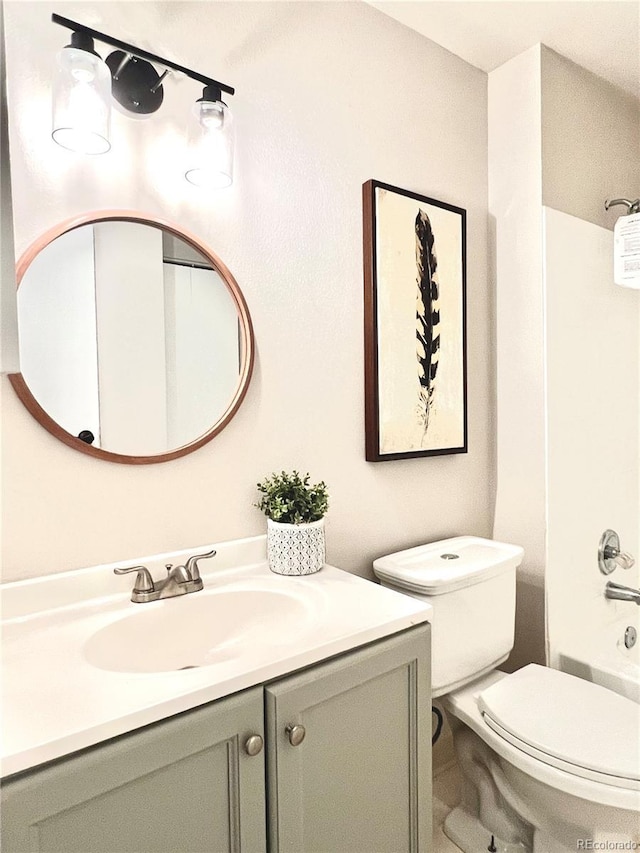 full bathroom with vanity, toilet, and shower / tub combination