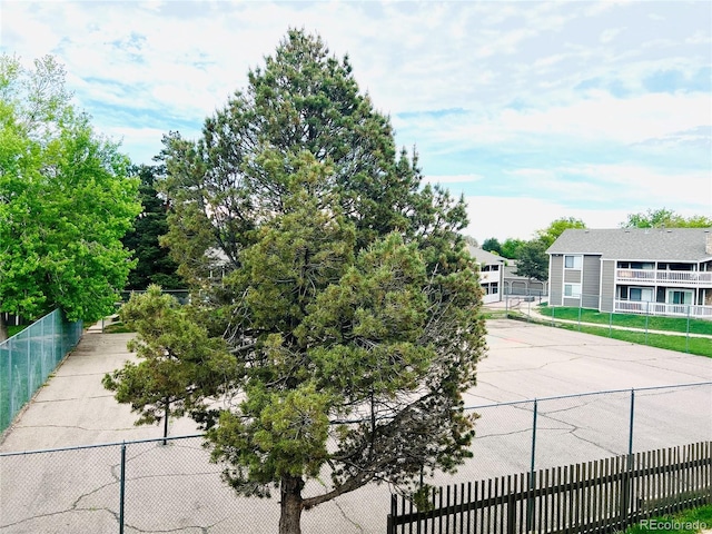 view of home's community with fence