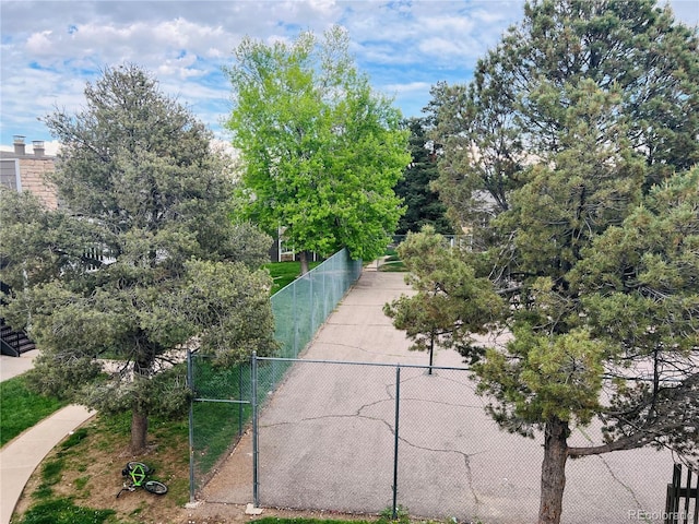 view of property's community featuring fence