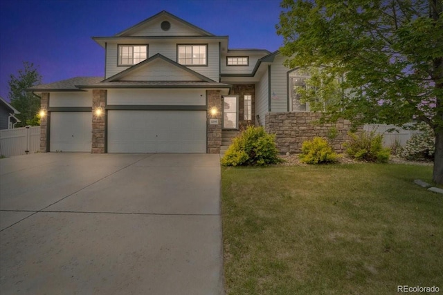 5286 Rustic Ave, Firestone, CO 80504 - view of front of property with driveway, an attached garage, and stone siding