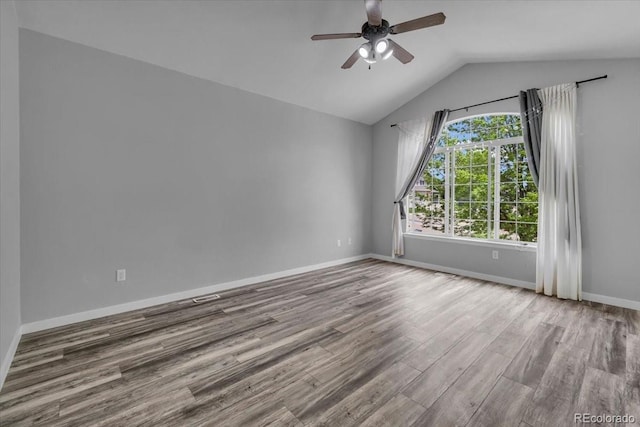 5286 Rustic Ave, Firestone, CO 80504 - spare room with ceiling fan, wood finished floors, lofted ceiling, and baseboards