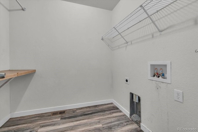 5286 Rustic Ave, Firestone, CO 80504 - washroom with hookup for a washing machine, wood finished floors, electric dryer hookup, and baseboards