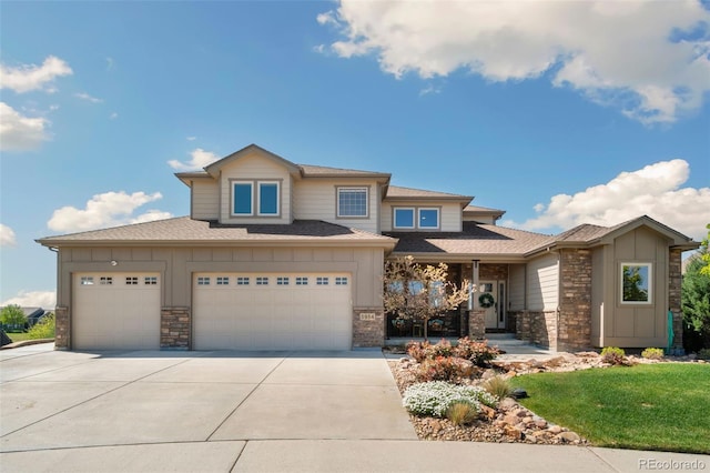 5954 Black Lion Ct, Windsor, CO 80550 - prairie-style home with board and batten siding, stone siding, concrete driveway, and roof with shingles