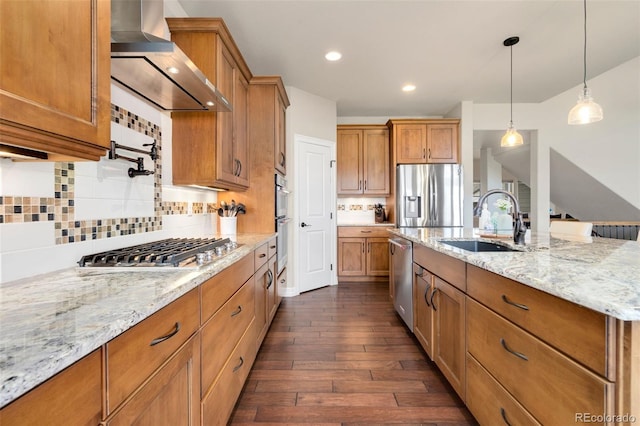 5954 Black Lion Ct, Windsor, CO 80550 - kitchen featuring a sink, wall chimney range hood, stainless steel appliances, dark wood-type flooring, and brown cabinets