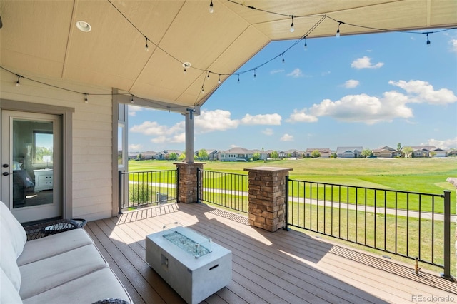 5954 Black Lion Ct, Windsor, CO 80550 - wooden deck with a residential view, a fire pit, a yard, and golf course view