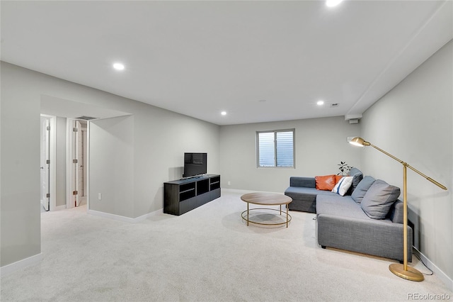 carpeted living area with visible vents, recessed lighting, and baseboards