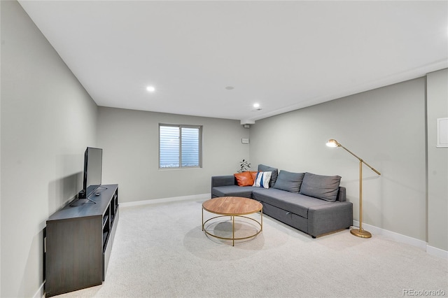 living area with recessed lighting, baseboards, and light carpet