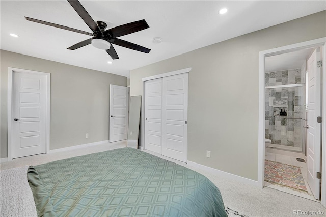 bedroom with carpet, baseboards, recessed lighting, ceiling fan, and ensuite bathroom