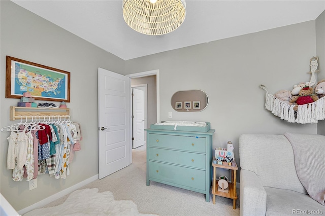 carpeted bedroom with baseboards