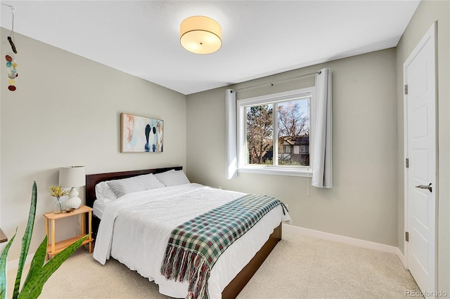 bedroom featuring baseboards and carpet floors