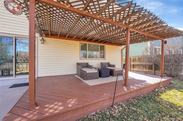 deck featuring an outdoor living space, a pergola, and fence